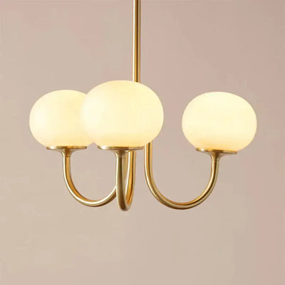Cream pink bedroom pendant light with three glass globes and brass