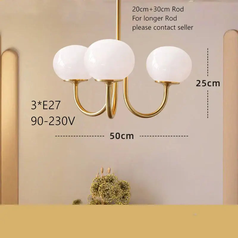Cream pink bedroom pendant light with three glass globes and brass