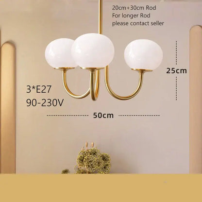 Cream pink bedroom pendant light with three glass globes and brass