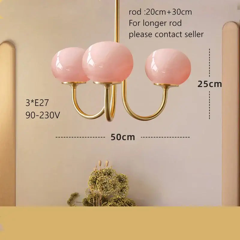Cream pink bedroom pendant light with three glass globes and brass