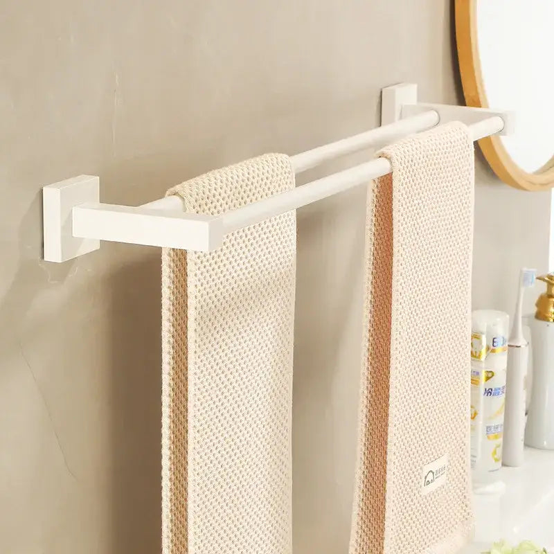 Cream white bathroom set with towel rack and storage shelf