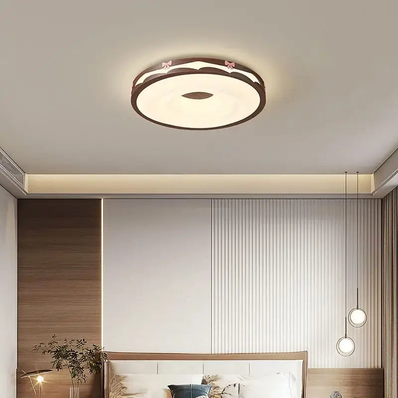 Cream wind walnut round bedroom light with pink bow hanging bulb