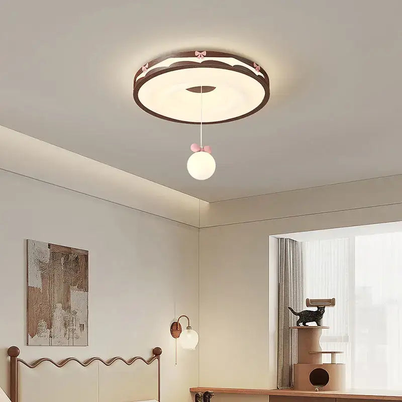 Cream wind walnut round bedroom light with pink bow hanging bulb