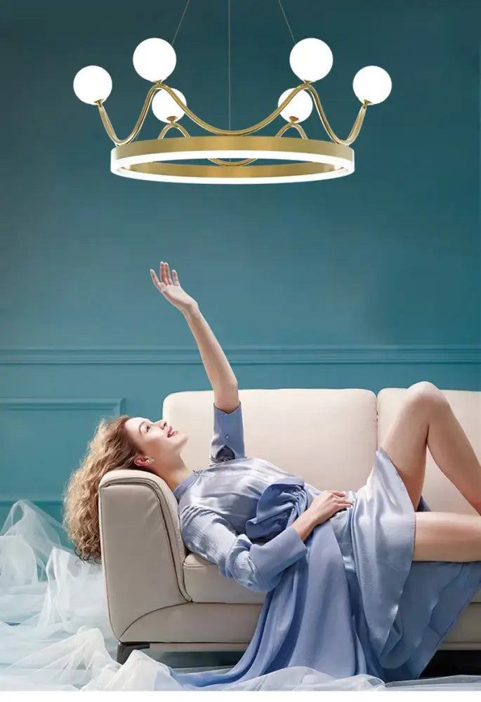 Crown design gold chandelier with white spheres for living room