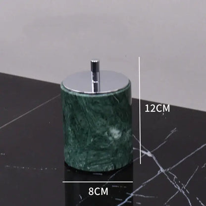 Dark green marble bathroom accessory set with gold accents