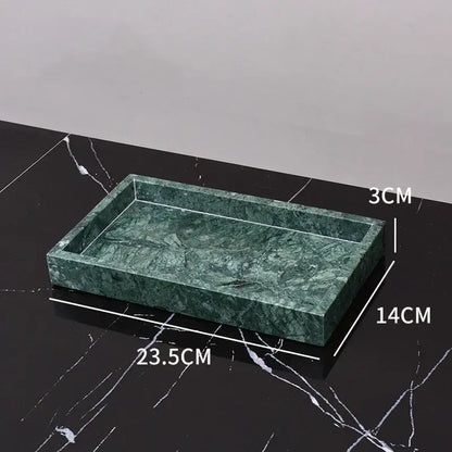 Dark green marble bathroom accessory set with gold accents