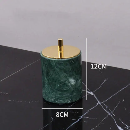 Dark green marble bathroom accessory set with gold accents