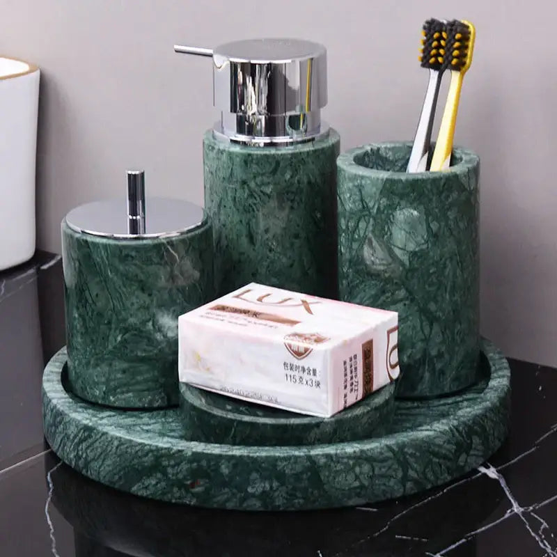 Dark green marble bathroom accessory set with gold accents