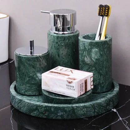 Dark green marble bathroom accessory set with gold accents