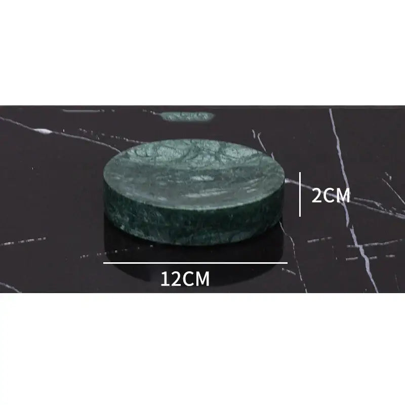 Dark green marble bathroom accessory set with gold accents