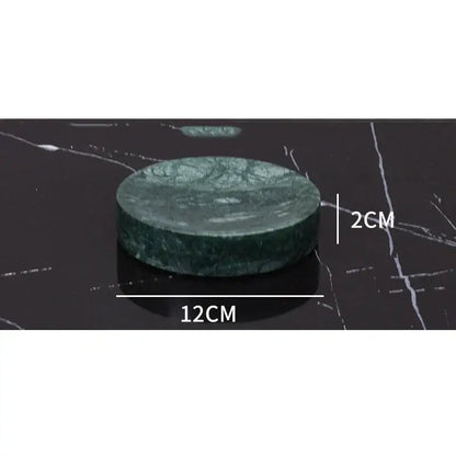 Dark green marble bathroom accessory set with gold accents
