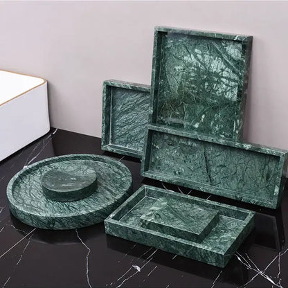 Dark green marble bathroom accessory set with gold accents