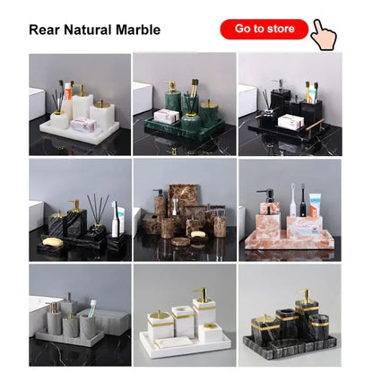 Dark green marble bathroom accessory set with gold accents