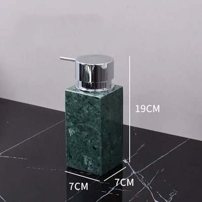 Dark green marble bathroom accessory set with gold accents