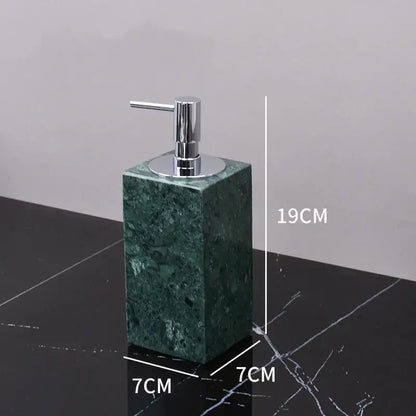 Dark green marble bathroom accessory set with gold accents