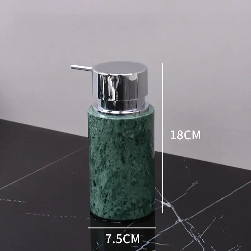 Dark green marble bathroom accessory set with gold accents