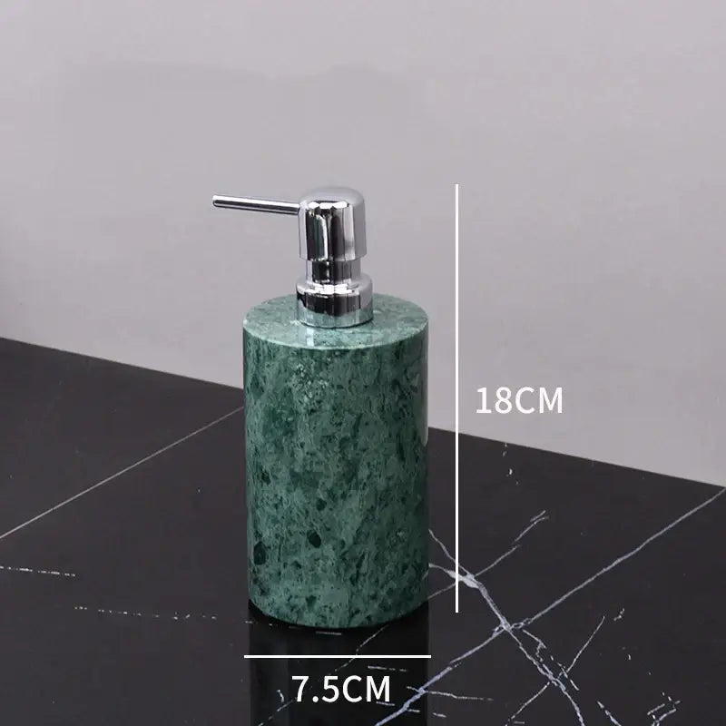 Dark green marble bathroom accessory set with gold accents