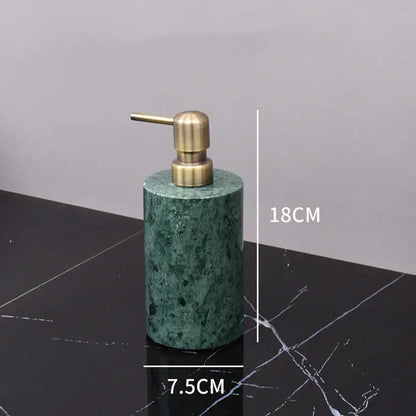 Dark green marble bathroom accessory set with gold accents