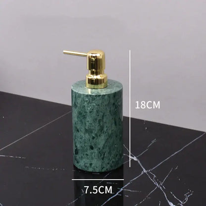 Dark green marble bathroom accessory set with gold accents