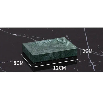 Dark green marble bathroom accessory set with gold accents