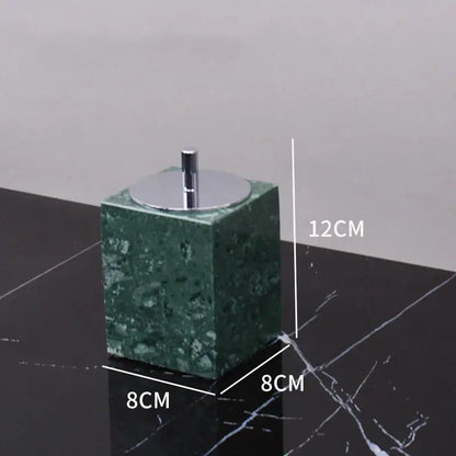 Dark green marble bathroom accessory set with gold accents