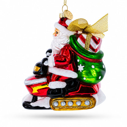 Santa Delivering Gifts on a Snowmobile Glass Christmas Ornament