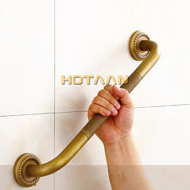 Decorative brass bathroom safety grab bar with rope detail for toilet