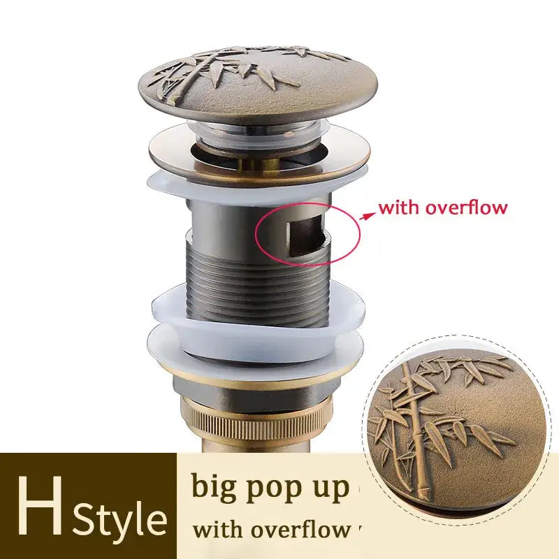 Decorative tree motif gold brass pop up drain bathroom sink
