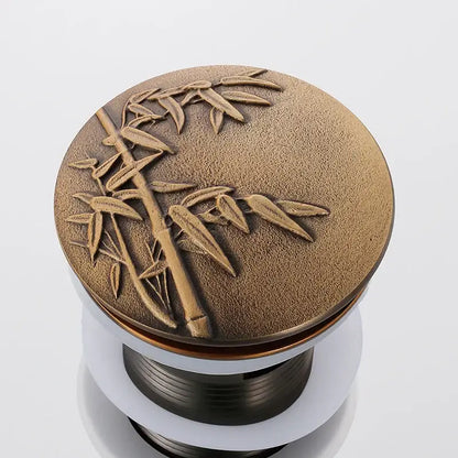 Decorative tree motif gold brass pop up drain bathroom sink