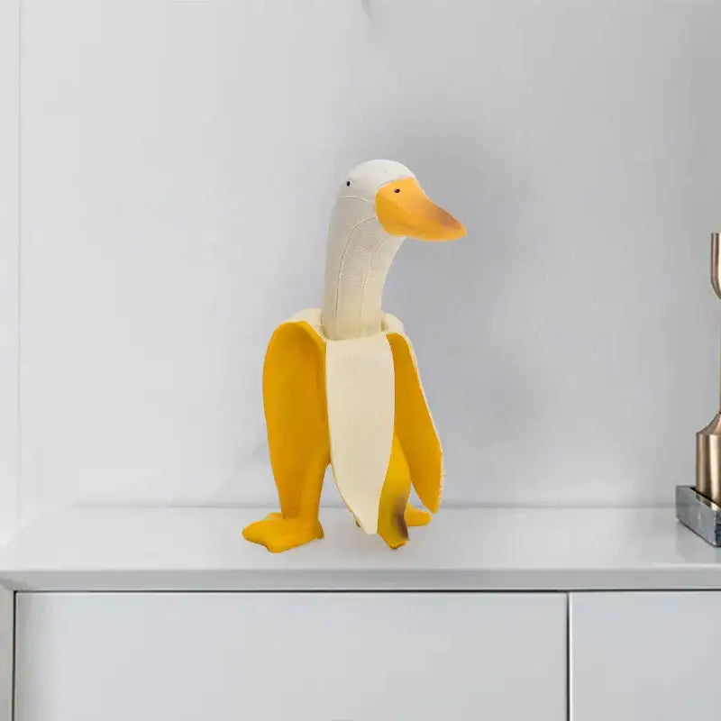 Whimsical white & yellow abstract banana duck sculpture living room decor