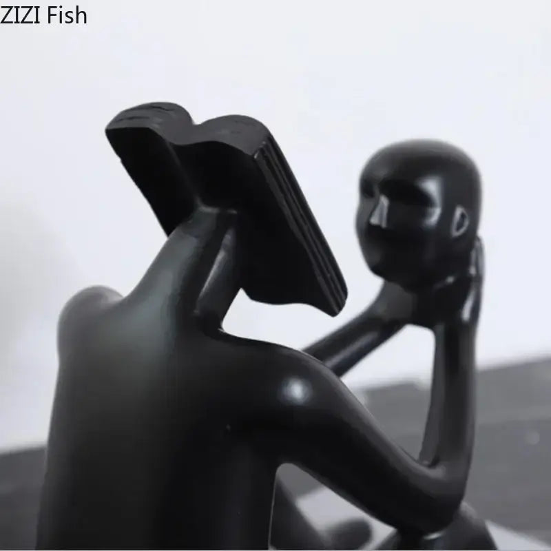 Modern black glossy abstract figure sculpture reading book bedroom decor