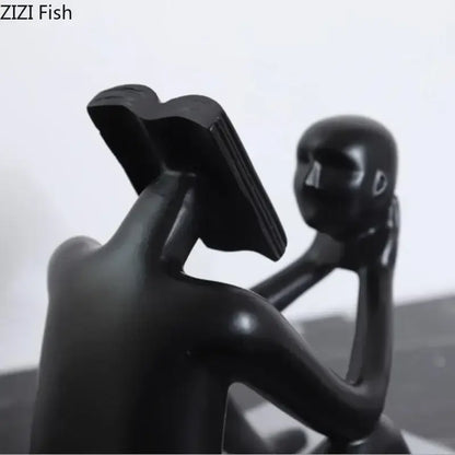 Modern black glossy abstract figure sculpture reading book bedroom decor