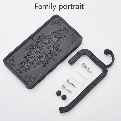 Ornate black metal toilet paper holder with phone shelf bathroom hook