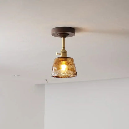Modern amber glass and copper ceiling light fixture dining room