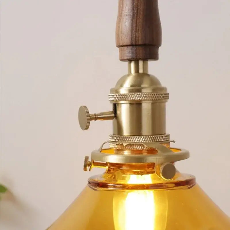 amber glass led pendant light with walnut dining room