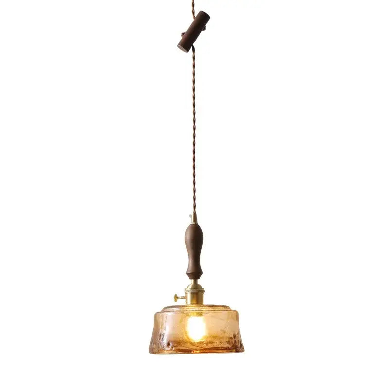 Modern amber glass pendant light with wood handle dining room