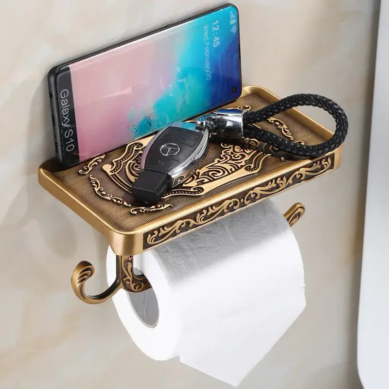 Antique brass ornate toilet paper holder with phone shelf bathroom
