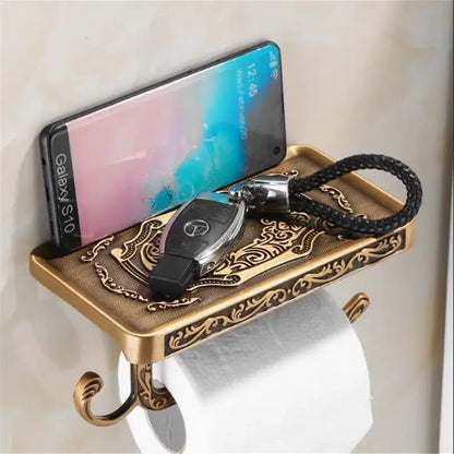 Antique brass ornate toilet paper holder with phone shelf bathroom