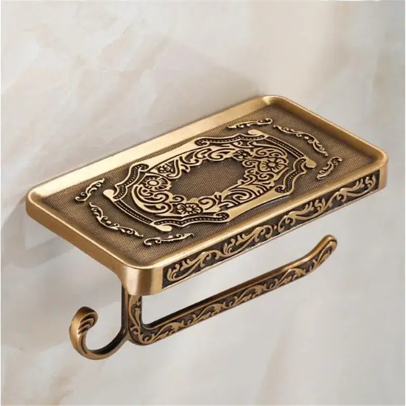 Antique brass ornate toilet paper holder with phone shelf bathroom