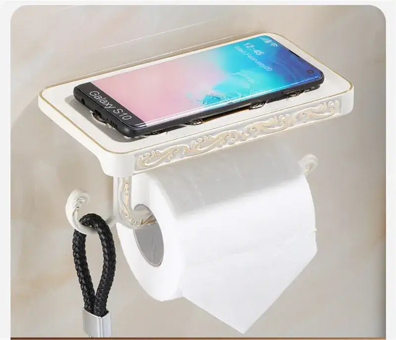 Antique brass ornate toilet paper holder with phone shelf bathroom