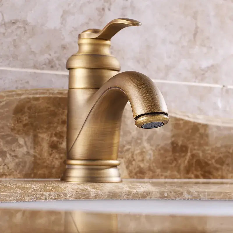 Antique brass basin faucet with curved spout for bathroom sinks