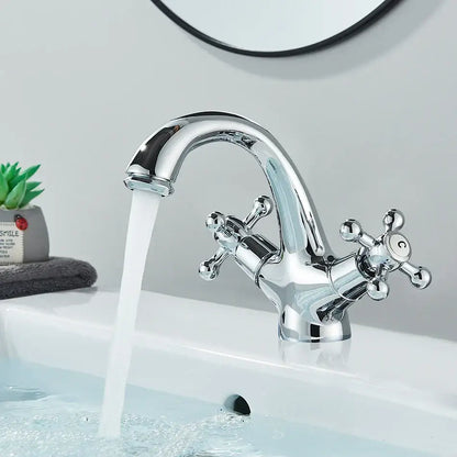 Antique brass basin faucet with ornate cross handles for bathroom