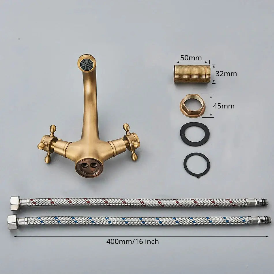 Antique brass basin faucet with ornate cross handles for bathroom