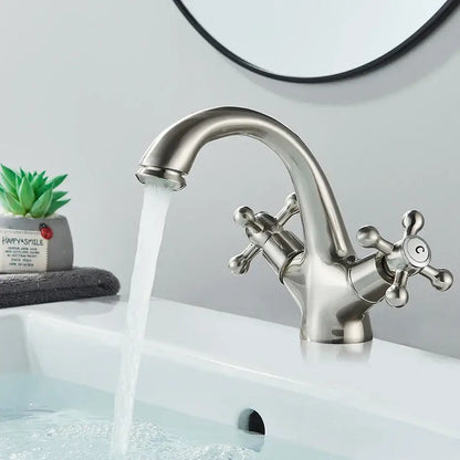 Antique brass basin faucet with ornate cross handles for bathroom