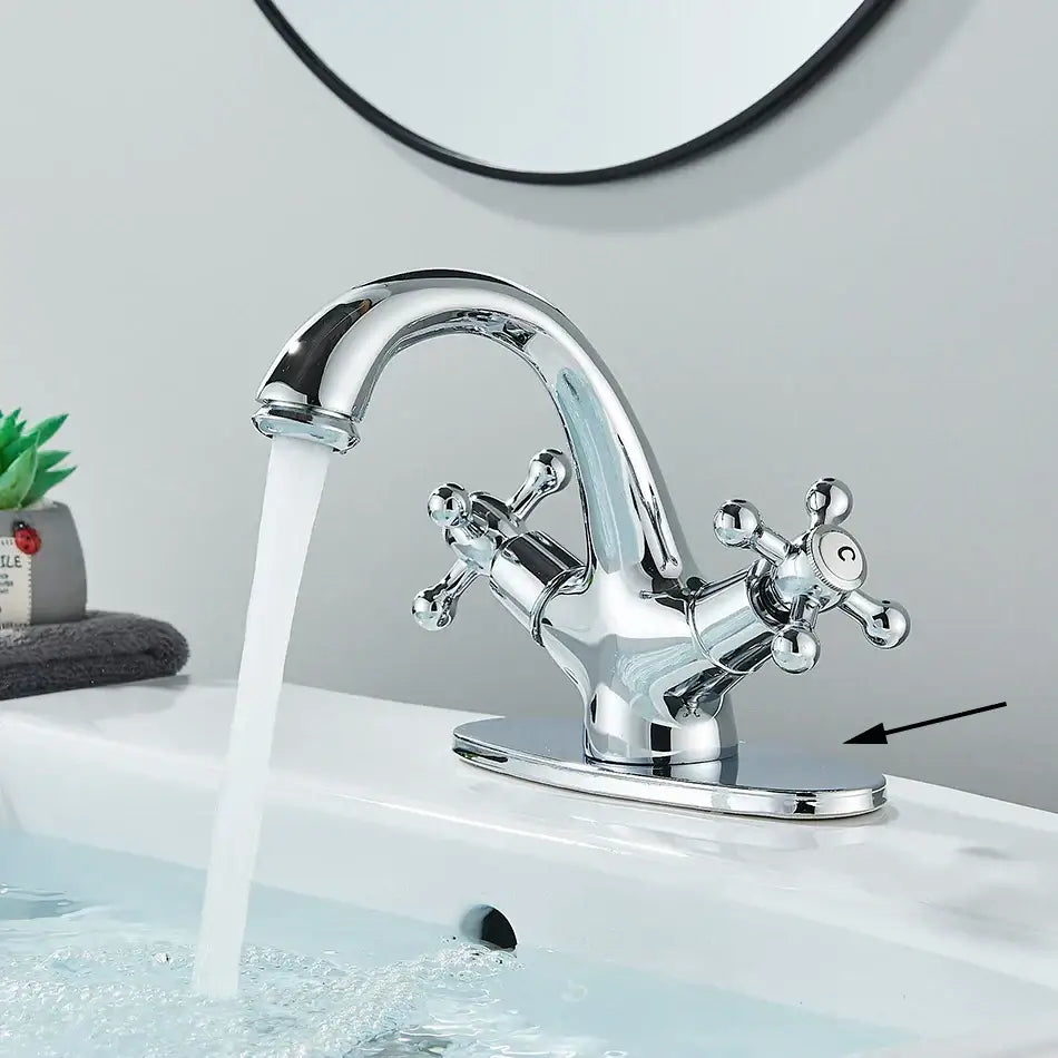 Antique brass basin faucet with ornate cross handles for bathroom
