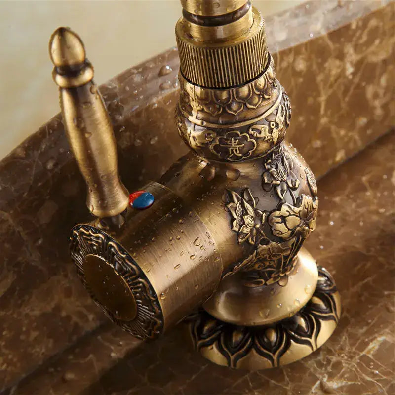Antique brass basin faucet with engraved floral detail kitchen tap
