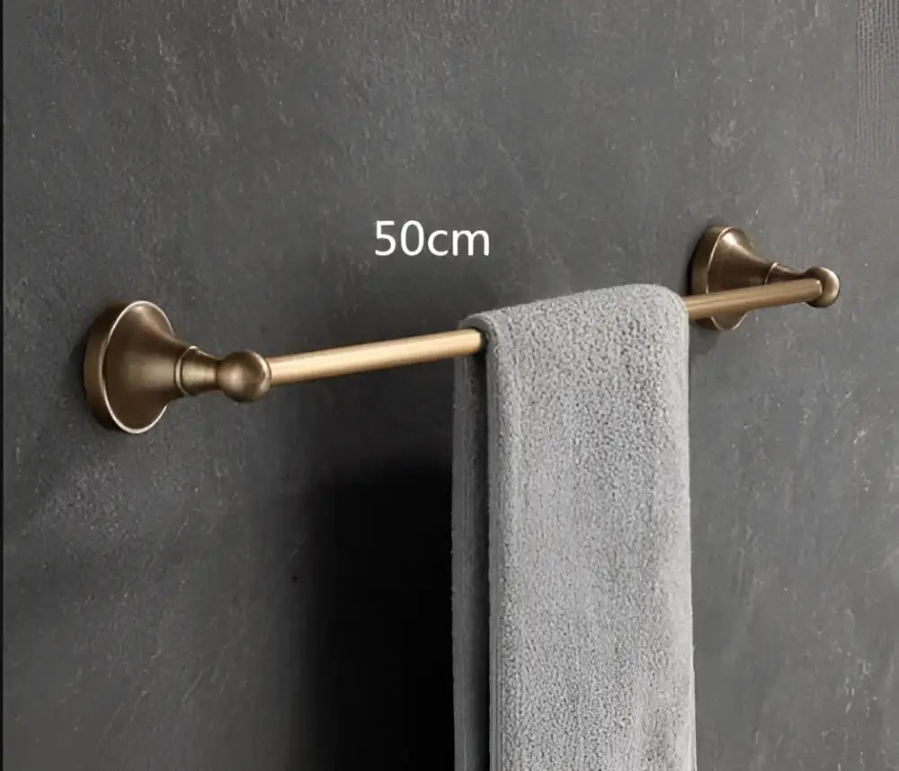 Antique brass bathroom accessory set with wall shelf
