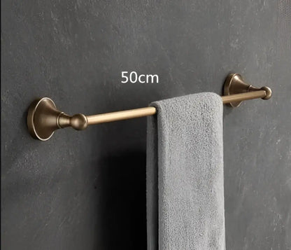 Antique brass bathroom accessory set with wall shelf