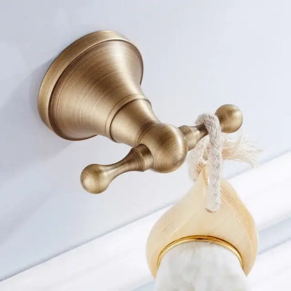 Antique brass bathroom accessory set with wall shelf