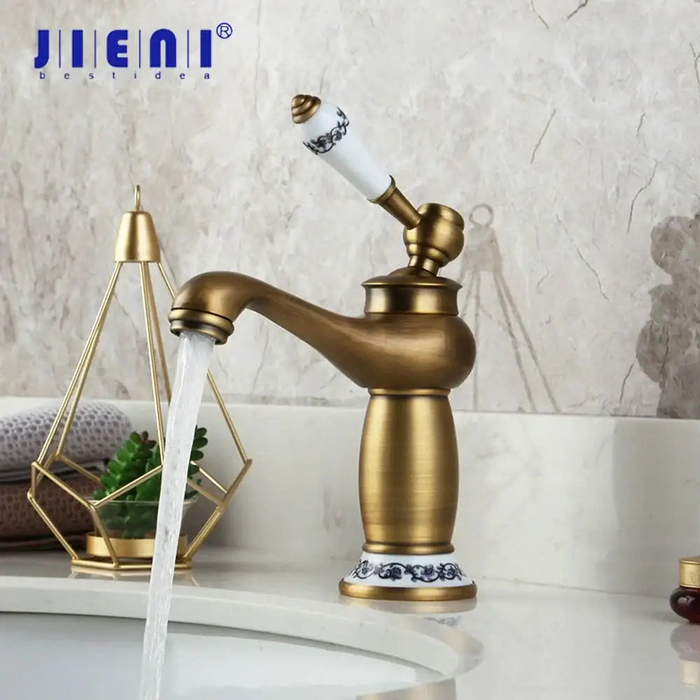 Antique brass bathroom basin faucet with floral ceramic handle